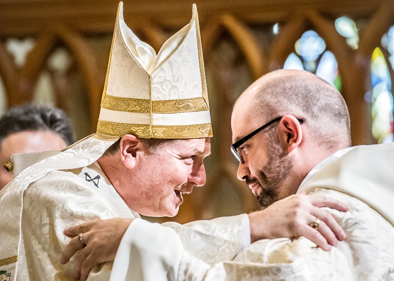 Archbishop Anthony Fisher OP embraces newly-ordained priest Fr Josh Miechels. Photo: Giovanni Portelli
